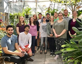 Group picture of Proceedings preprint team, in a room full of plants